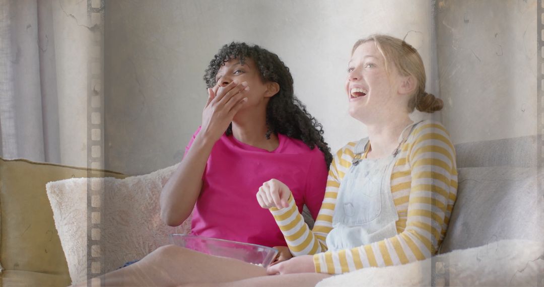 Teenage Friends Watching Movie with Popcorn at Home