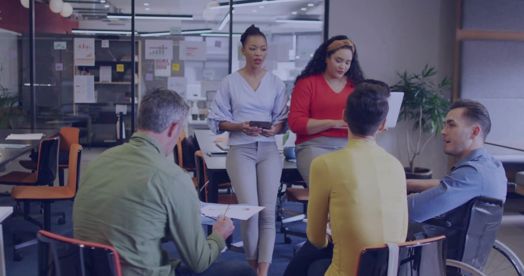 Diverse Team Collaborating in Modern Conference Room with Technology