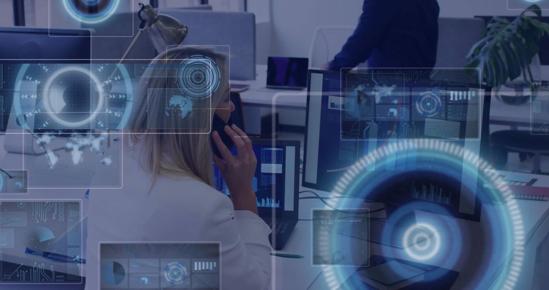 Woman Analyzing Digital Interfaces in Modern Office Setting