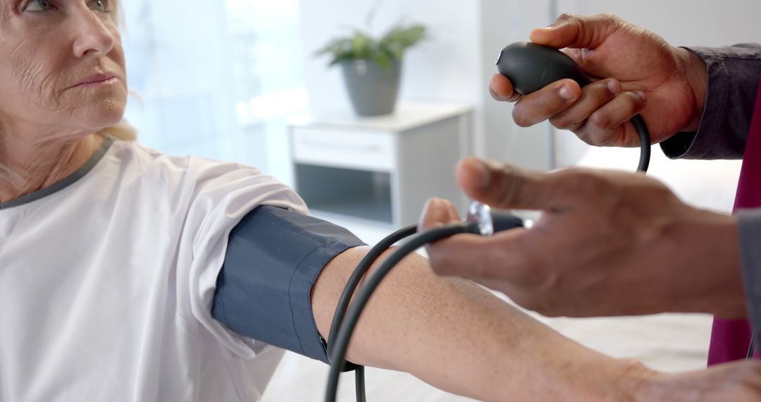 Medical Professional Measuring Blood Pressure of Elderly Patient - Free Images, Stock Photos and Pictures on Pikwizard.com