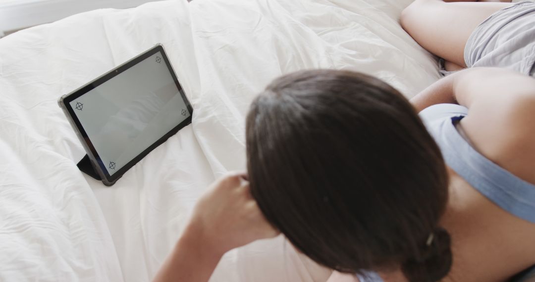 Woman Relaxing in Bed Using Tablet with Blank Screen - Free Images, Stock Photos and Pictures on Pikwizard.com