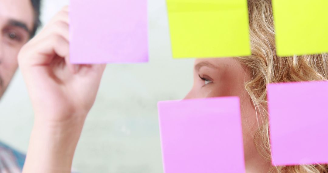 Team Brainstorming with Colorful Sticky Notes - Free Images, Stock Photos and Pictures on Pikwizard.com