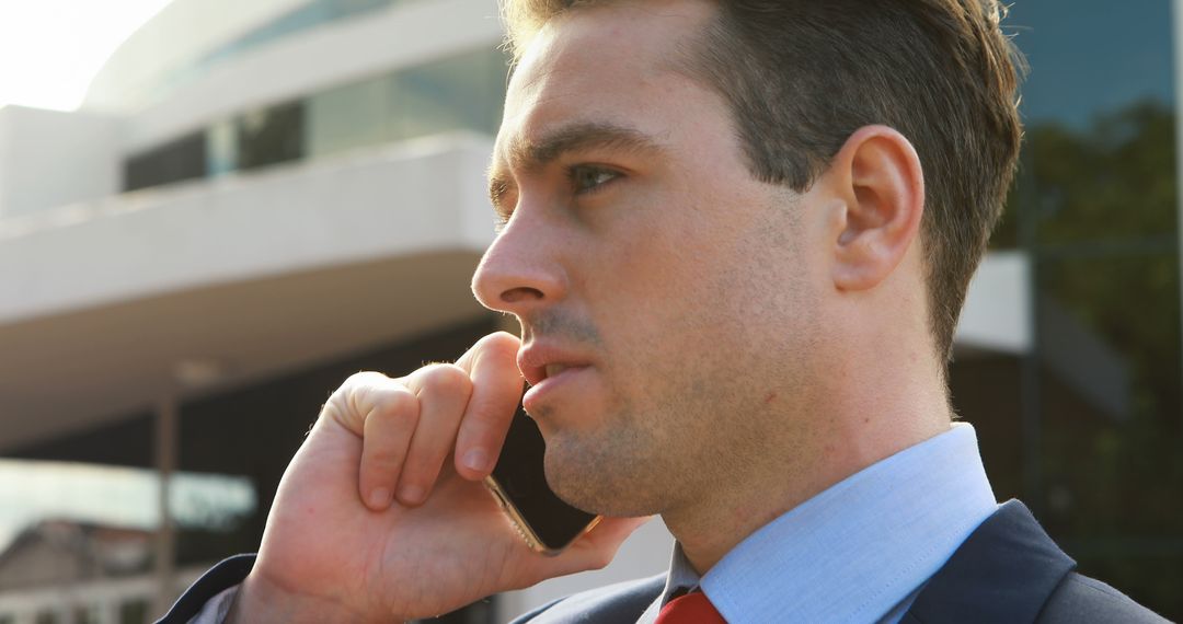 Focused Businessman Taking a Phone Call Outdoors - Free Images, Stock Photos and Pictures on Pikwizard.com