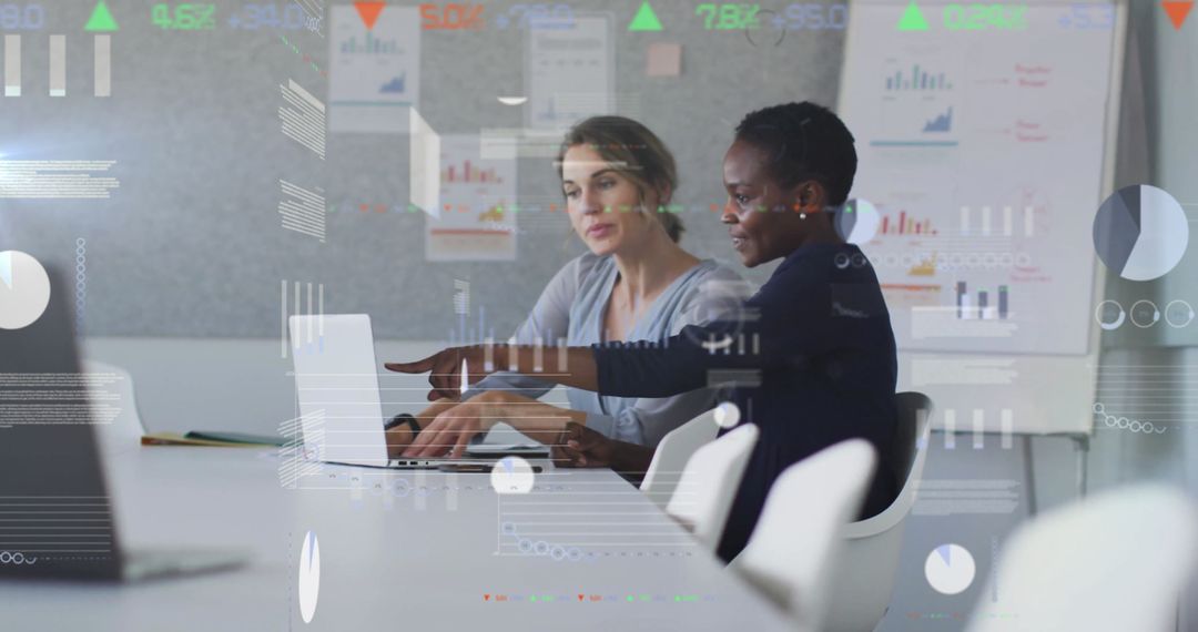 Digital Data Analysis with Diverse Colleagues Using Laptop in Modern Office