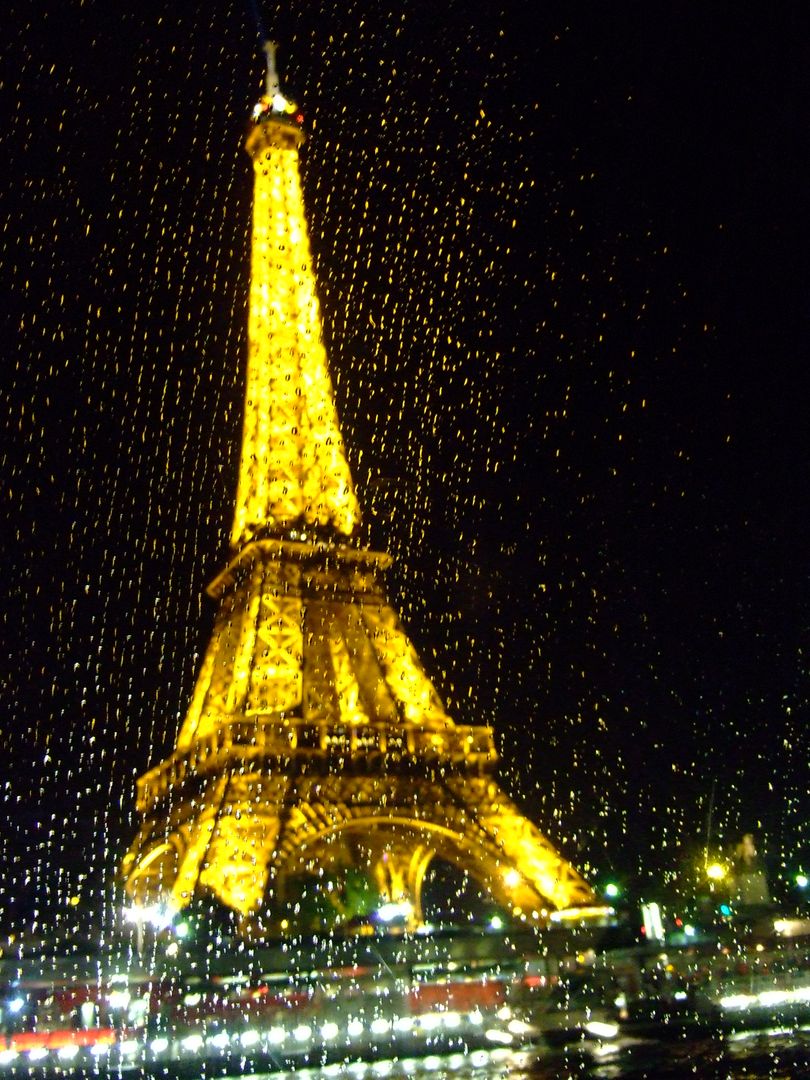 Eiffel Tower at Night with Rain Droplets on Window - Free Images, Stock Photos and Pictures on Pikwizard.com