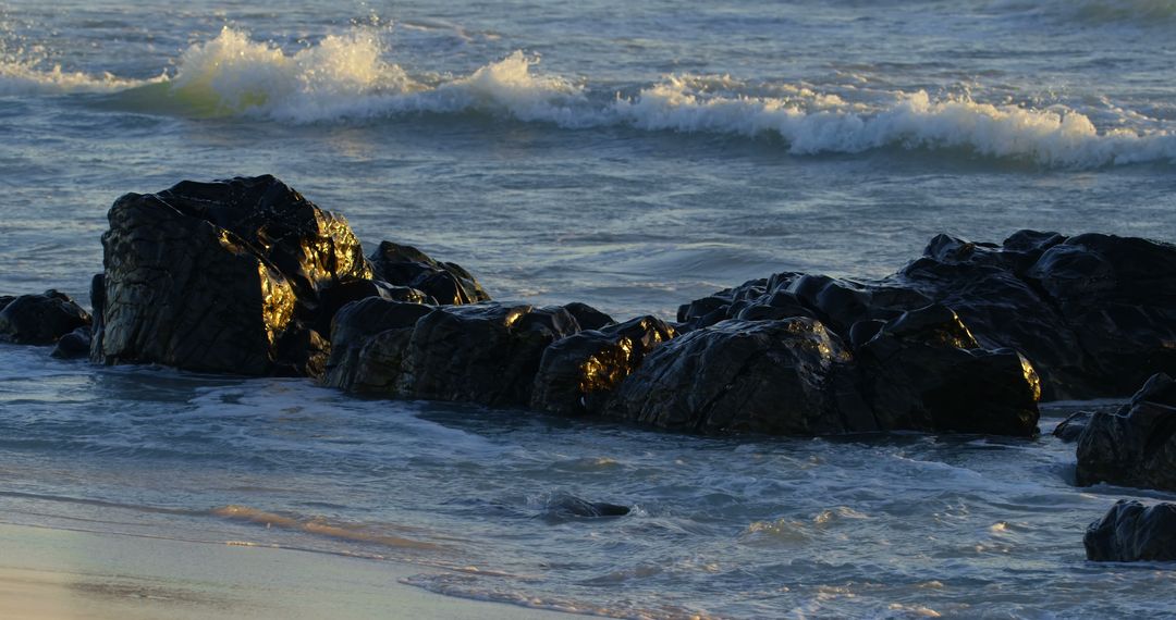 Waves Crashing on Rocky Shoreline at Sunset - Free Images, Stock Photos and Pictures on Pikwizard.com