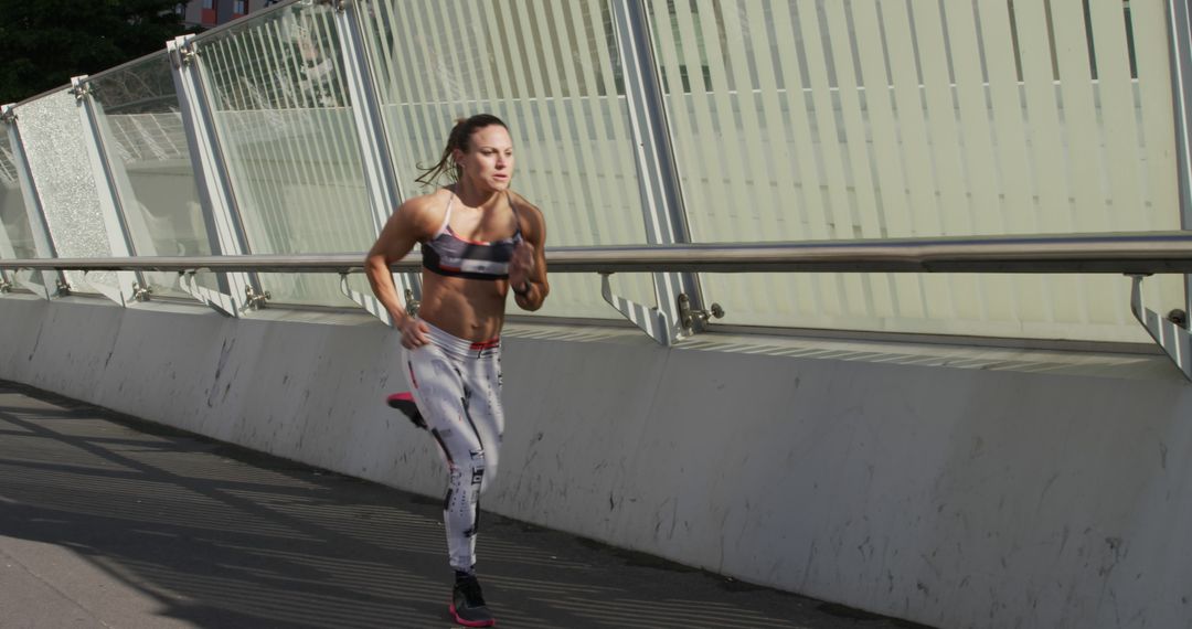 Female Athlete Running Outdoors in Urban Setting - Free Images, Stock Photos and Pictures on Pikwizard.com