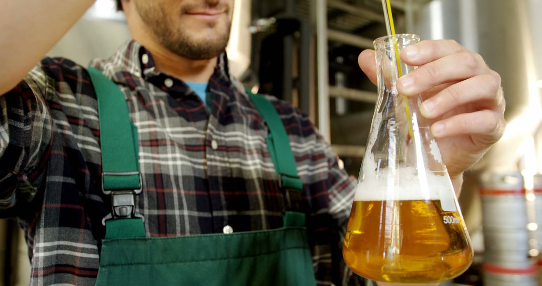 Microbrewer Examining Beer Sample in Laboratory - Free Images, Stock Photos and Pictures on Pikwizard.com