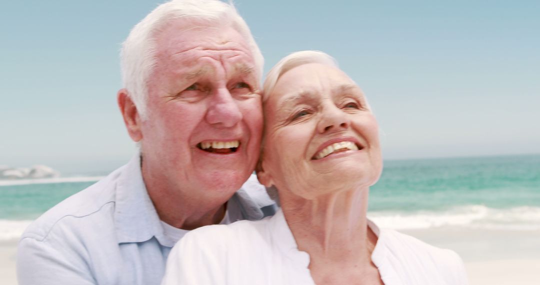 Happy Senior Couple Enjoying Beach Day Together - Free Images, Stock Photos and Pictures on Pikwizard.com