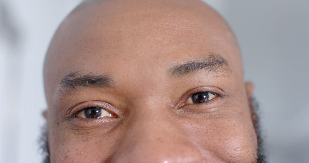 Close-Up of Smiling Man's Eyes and Forehead - Free Images, Stock Photos and Pictures on Pikwizard.com