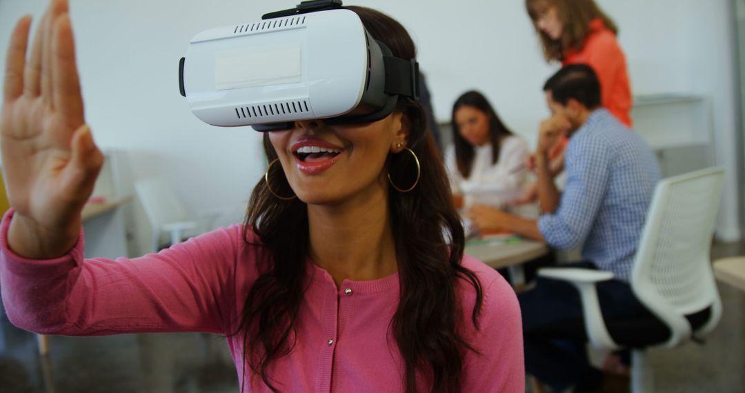 Happy Woman Experiencing Virtual Reality at Office - Free Images, Stock Photos and Pictures on Pikwizard.com