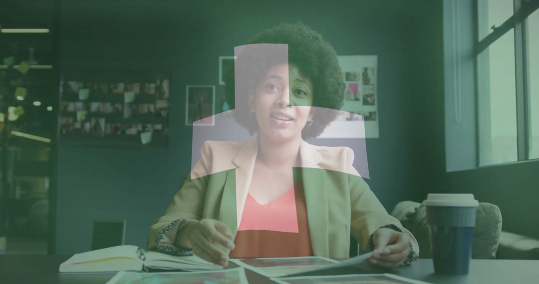 Creative Professional Reviewing Layouts at Modern Office Workspace