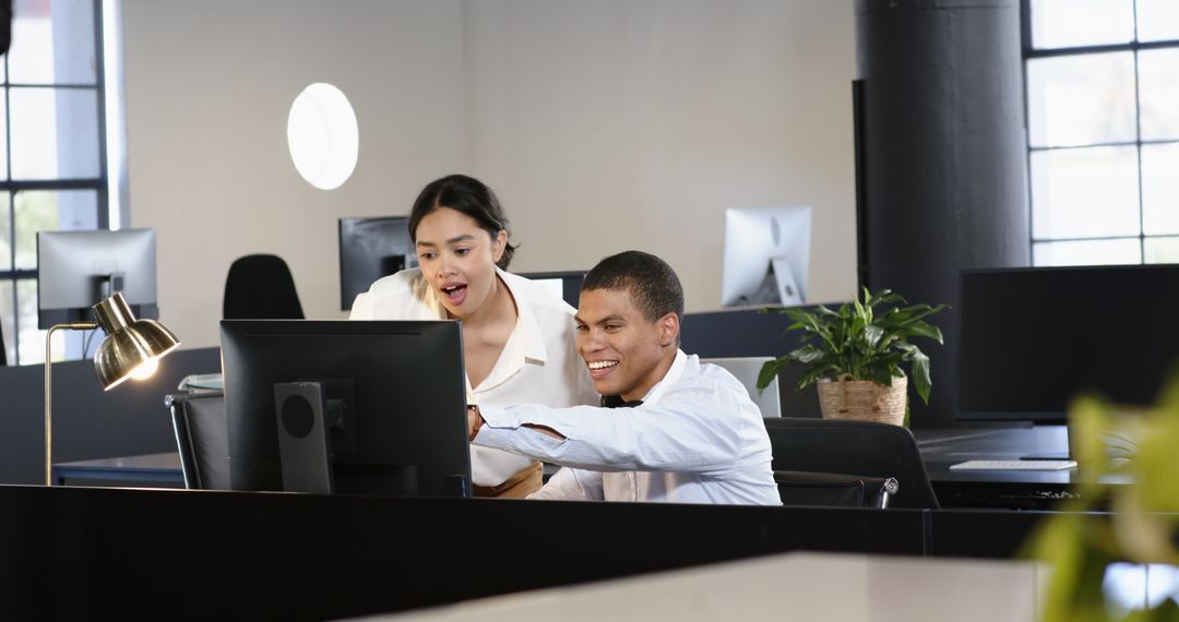 Cheerful Co-Workers Collaborating in Modern Office