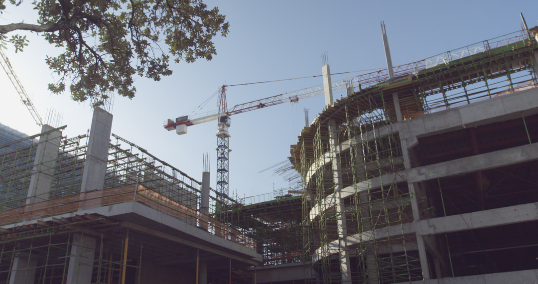 Transparent Crane and Steel Frames Under Blue Sky at Building Construction Site - Download Free Stock Images Pikwizard.com