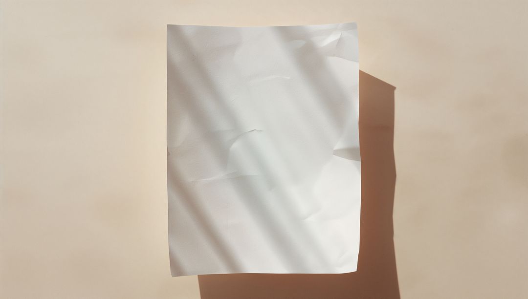 White Crumpled Paper Casting Abstract Shadows on Beige