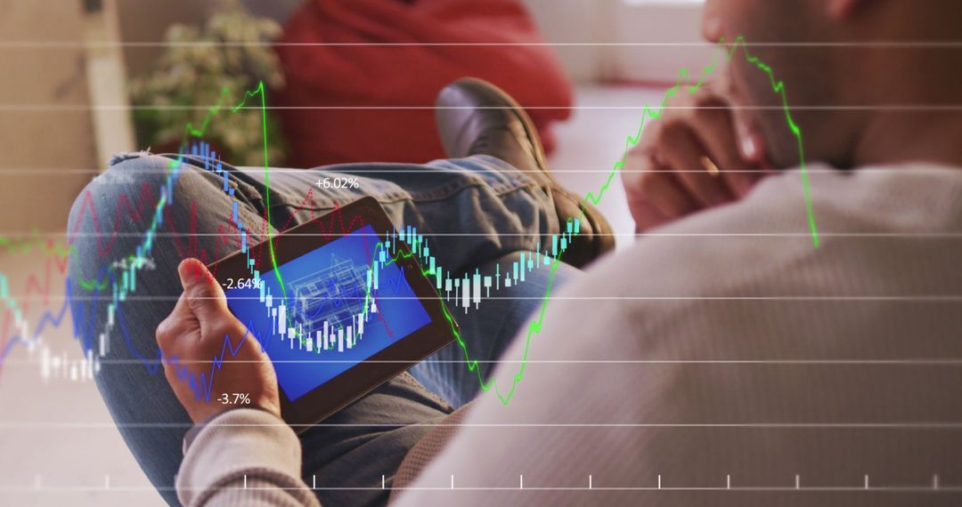 Analyzing Stock Market Trends on Digital Tablet at Café