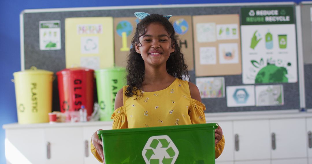 Smiling Girl Holding Recycling Bin in Classroom Promoting Environmental Awareness - Free Images, Stock Photos and Pictures on Pikwizard.com