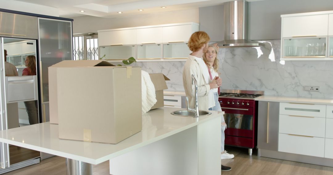 Couple Exploring New Kitchen During Moving Day