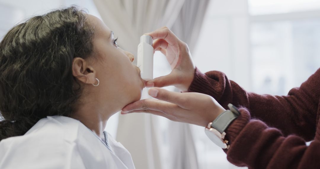 Doctor Giving Child Breathing Treatment with Inhaler in Clinic - Free Images, Stock Photos and Pictures on Pikwizard.com