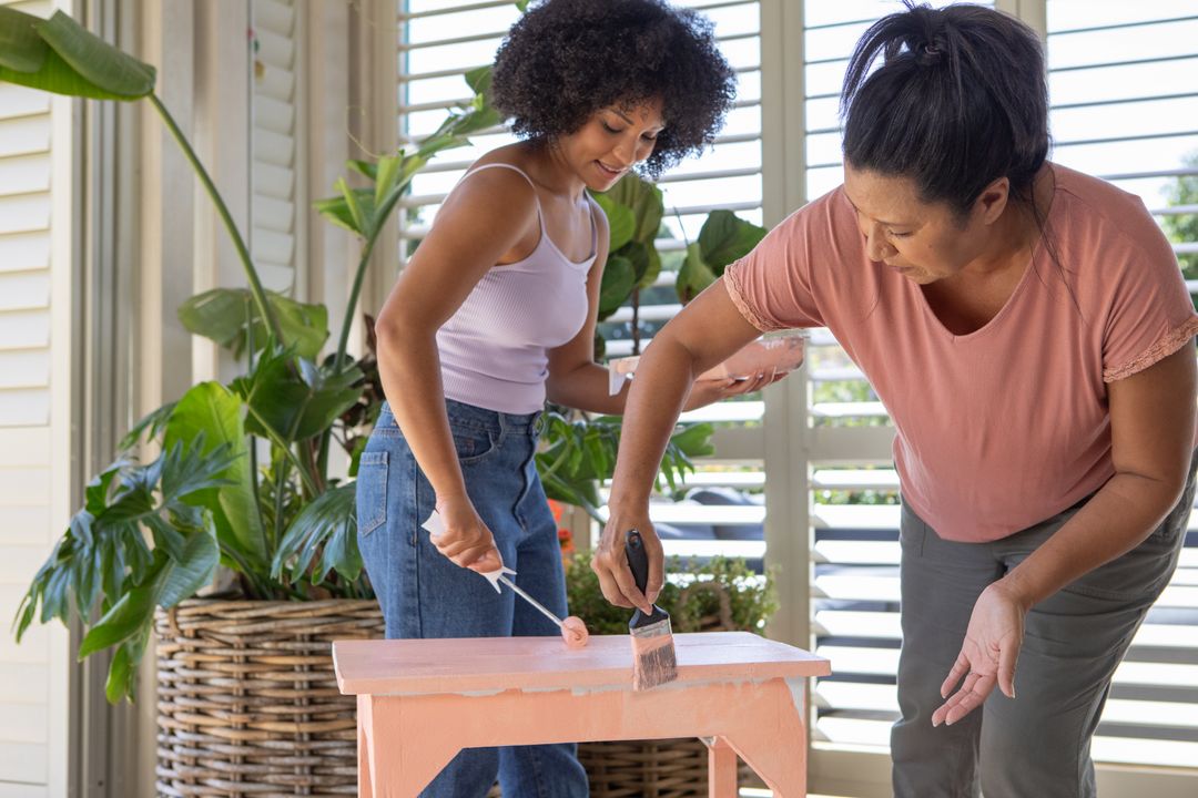 Mother and Daughter in Porch Painting Project with Wooden Bench