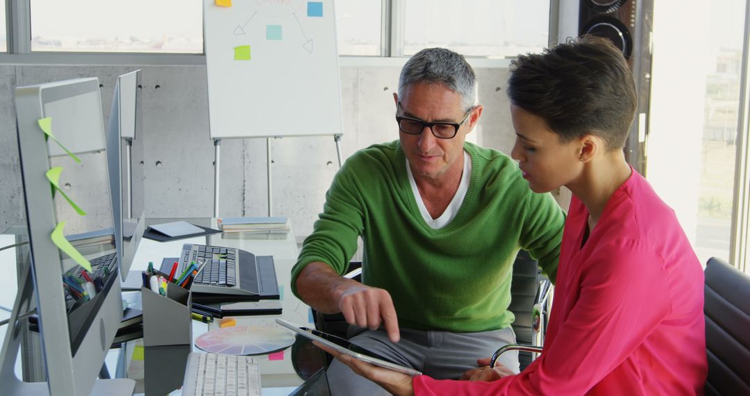 Collaborating Coworkers with Tablet in Bright Modern Office