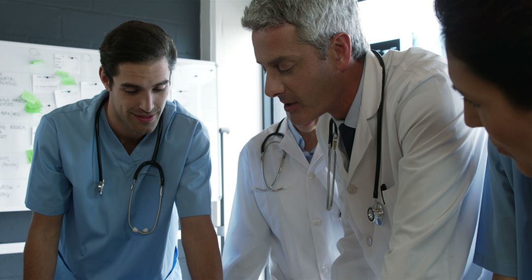 Doctors Collaborating in Conference Room for Medical Review