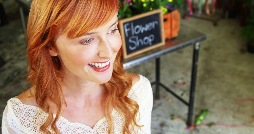 Smiling Redheaded Woman Outside Flower Shop - Free Images, Stock Photos and Pictures on Pikwizard.com