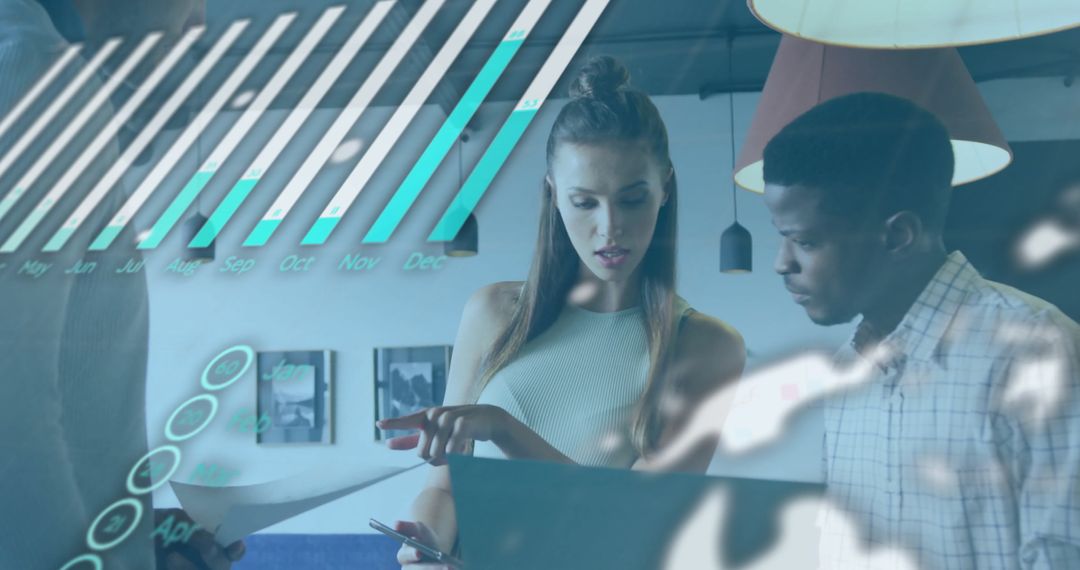 Diverse Colleagues Analyzing Data in Modern Office