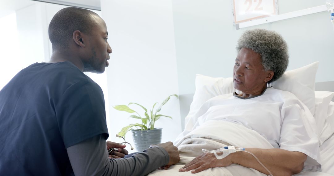 Nurse Assisting Senior Patient in Hospital Bed - Free Images, Stock Photos and Pictures on Pikwizard.com