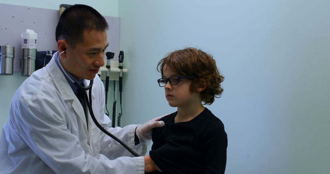 Doctor Examining Young Child with Stethoscope in Medical Office - Free Images, Stock Photos and Pictures on Pikwizard.com