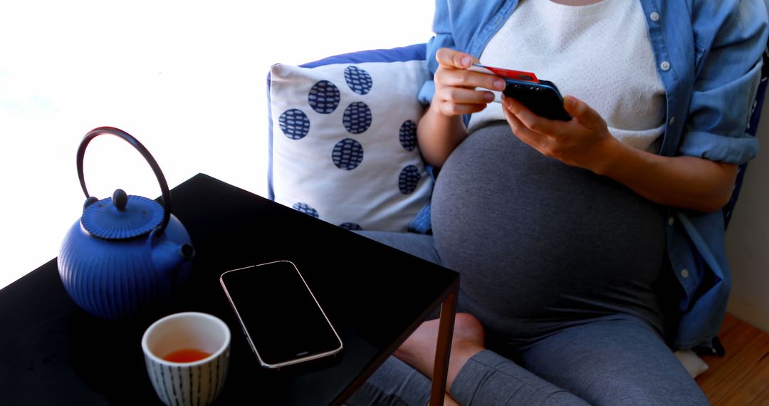 Pregnant Woman Shopping Online with Credit Card and Smartphone - Free Images, Stock Photos and Pictures on Pikwizard.com