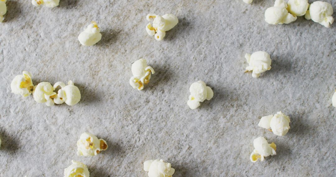 Scattered Popcorn on Gray Surface with Ample Copy Space