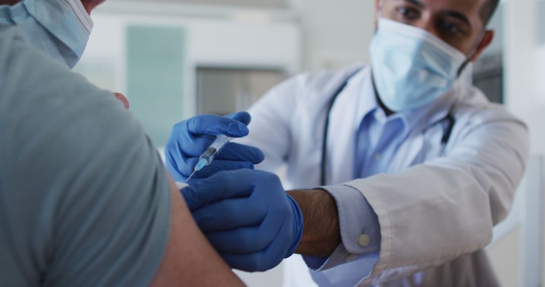 Doctor Administering Vaccine to Patient in Medical Clinic - Free Images, Stock Photos and Pictures on Pikwizard.com