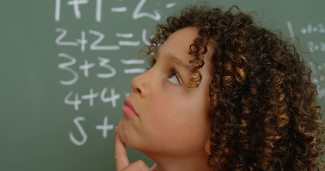 Young Boy Deep in Thought in Classroom