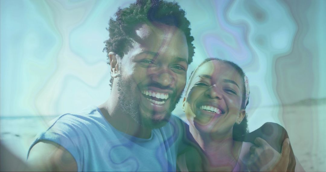 Couple Smiling and Relaxing at Sunny Beach Shoreline