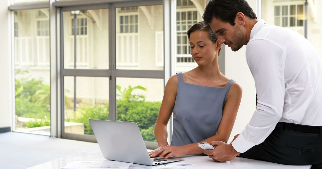 Focused Business Collaboration in a Modern Office Setting