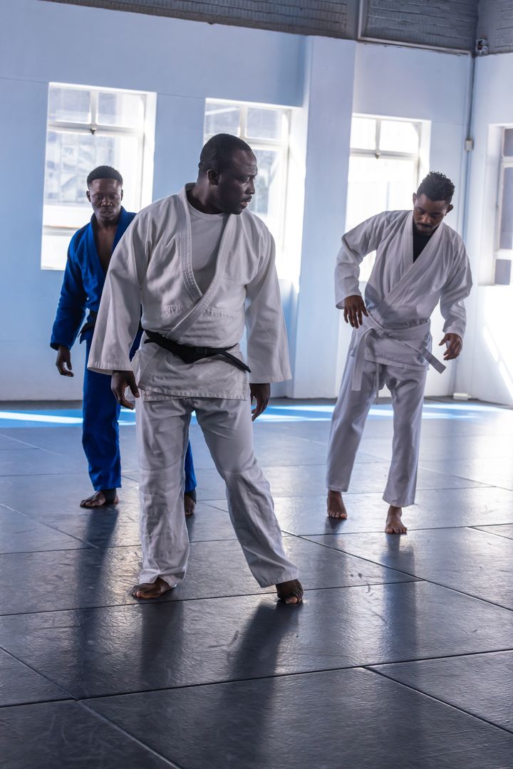 African American Men Practicing Judo Footwork in Studio