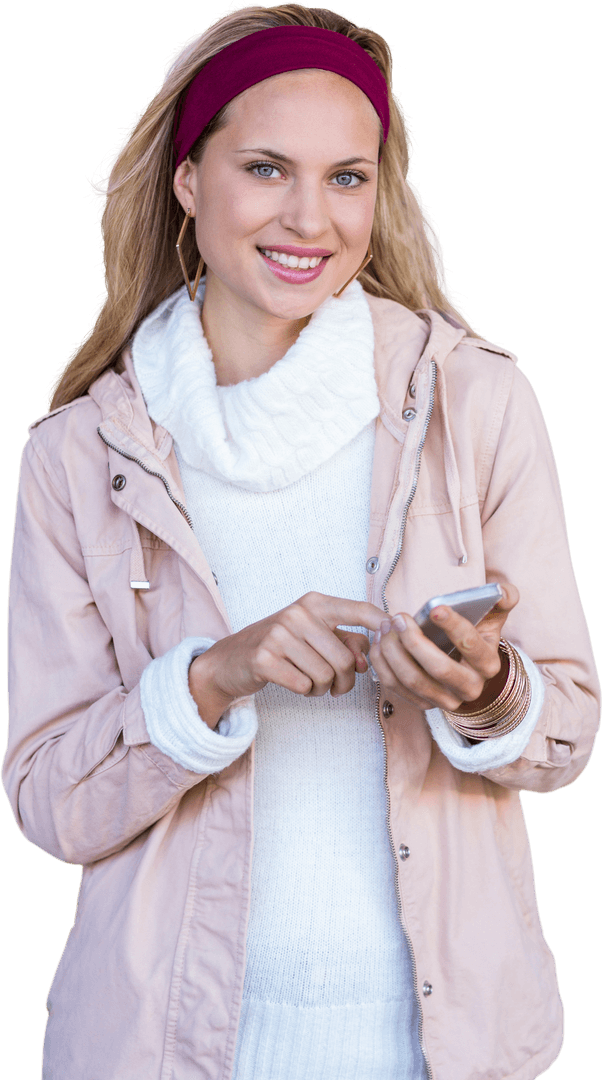 Smiling Woman in Jacket Using Smartphone on White Background