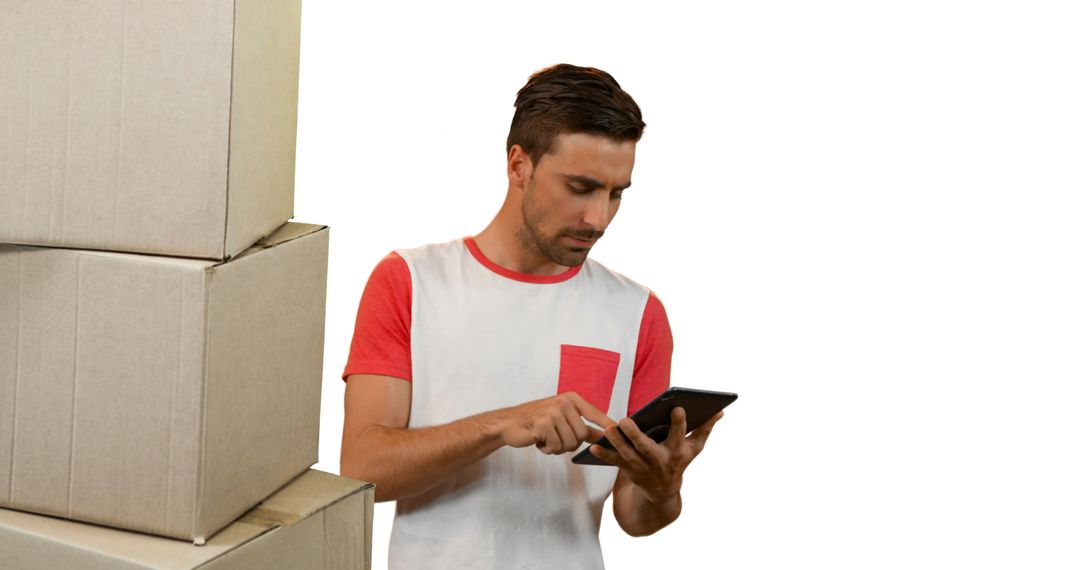 Man Managing Inventory with Tablet Amidst Box Stack