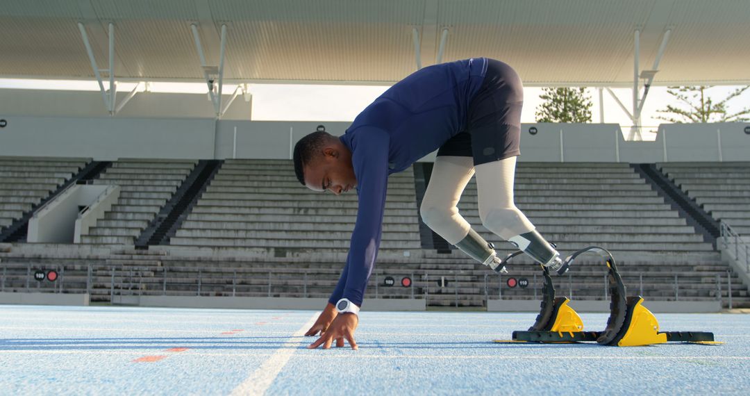 Paralympic Athlete with Prosthetic Legs Ready to Sprint on Track - Free Images, Stock Photos and Pictures on Pikwizard.com