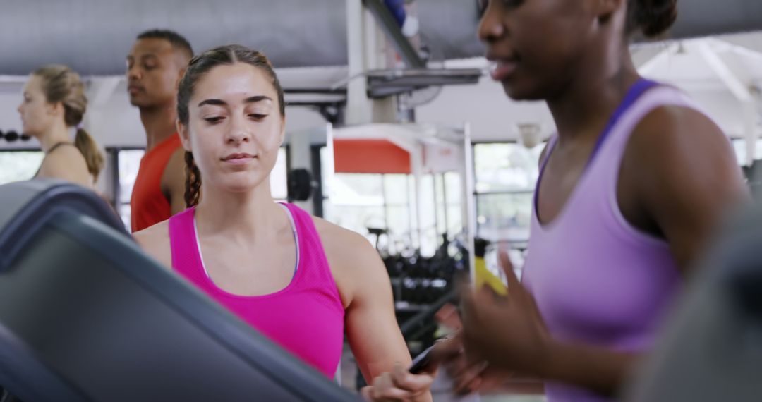 Young Women Focused on Cardio Workout at Gym Treadmills - Free Images, Stock Photos and Pictures on Pikwizard.com