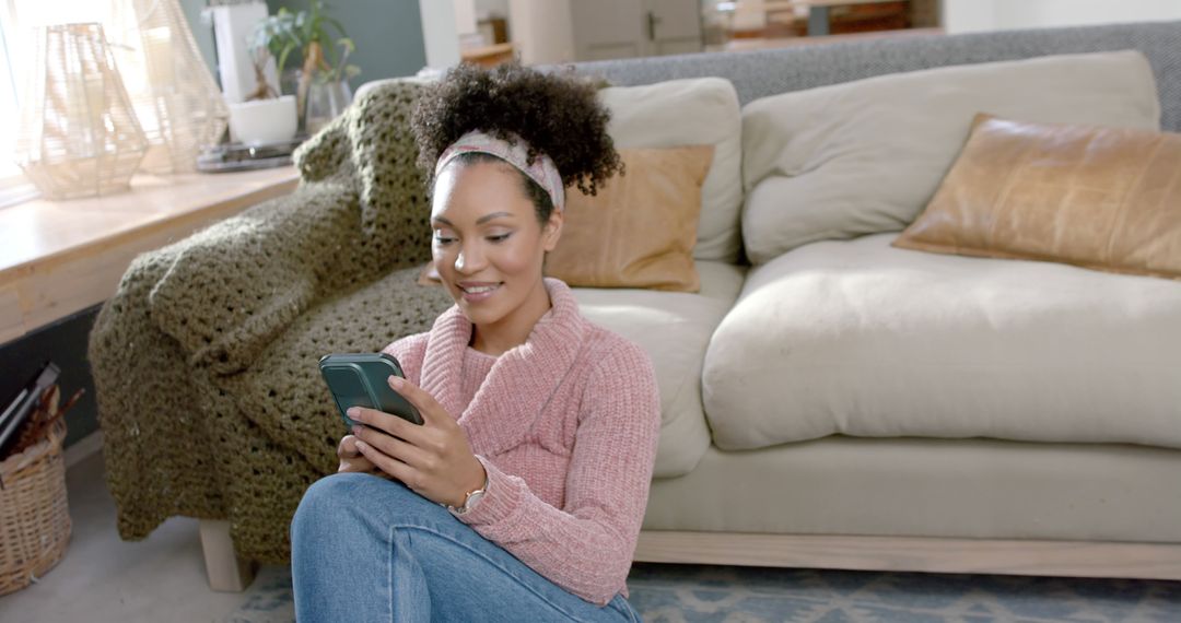 Woman Sitting on Floor Using Smartphone at Home - Free Images, Stock Photos and Pictures on Pikwizard.com