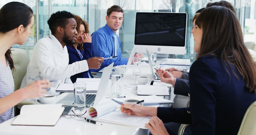 Diverse Team Engaged in Business Meeting at Modern Conference Room