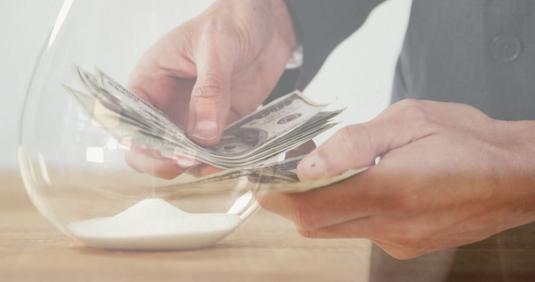 Counting Dollars with Hourglass Overlay Representing Time and Finance