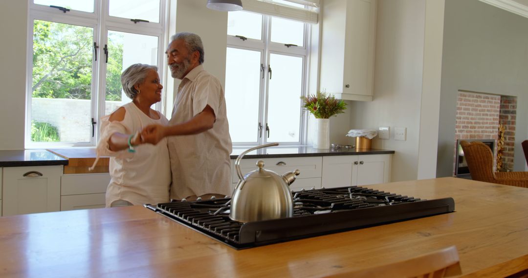 Senior Black Couple Joyfully Dancing Together in Modern Kitchen - Free Images, Stock Photos and Pictures on Pikwizard.com