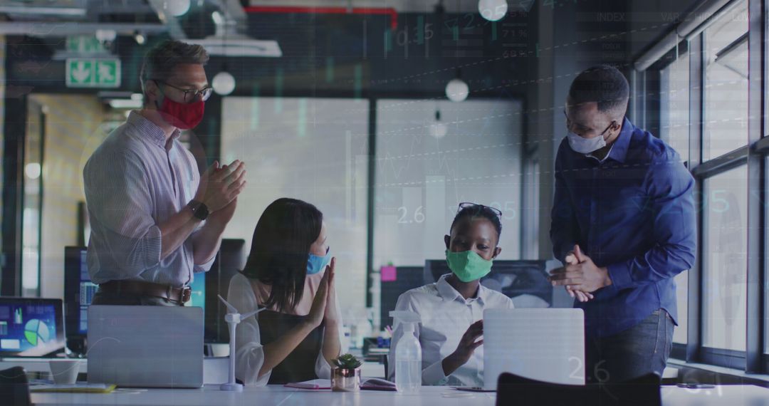 Office Team Clapping with Digital Interface and Face Masks