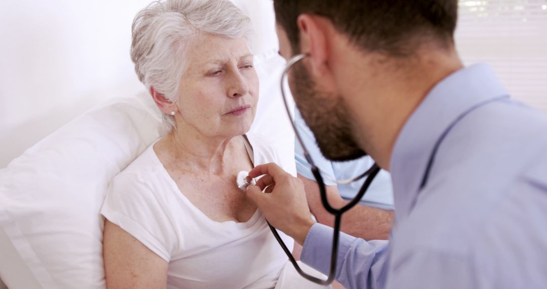 Doctor Examining Senior Woman with Stethoscope in Medical Consultation - Free Images, Stock Photos and Pictures on Pikwizard.com