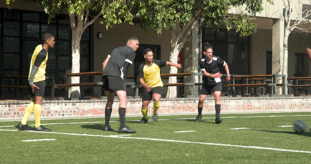 Teenagers Enhancing Soccer Skills on a Sunny School Field