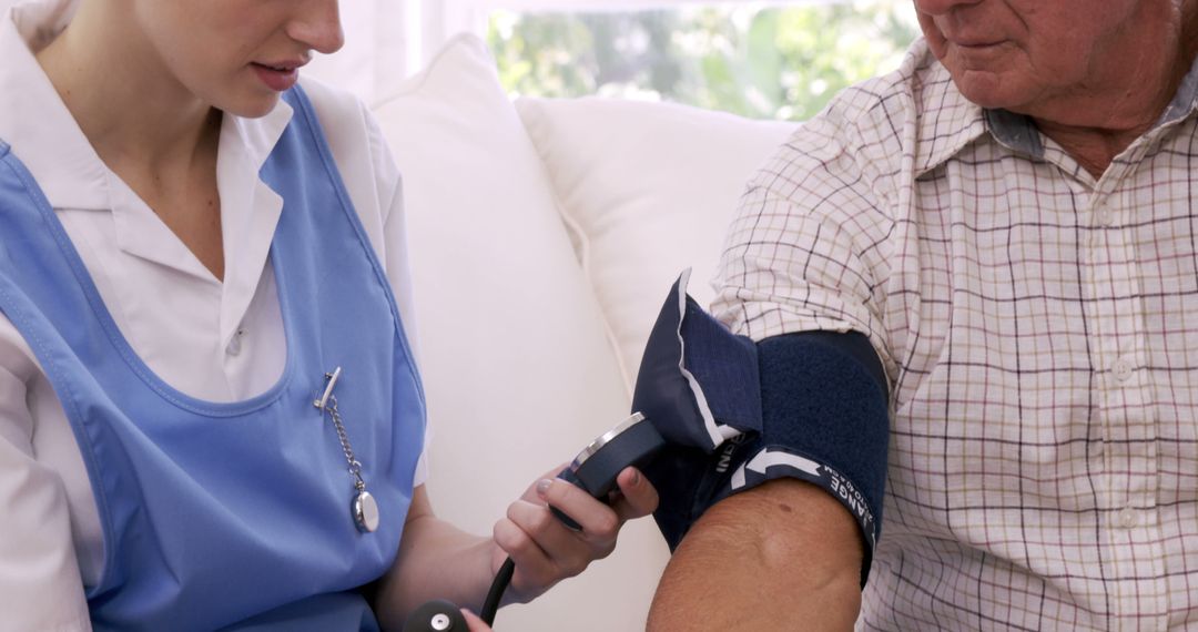 Nurse Measuring Blood Pressure of Elderly Patient at Home - Free Images, Stock Photos and Pictures on Pikwizard.com