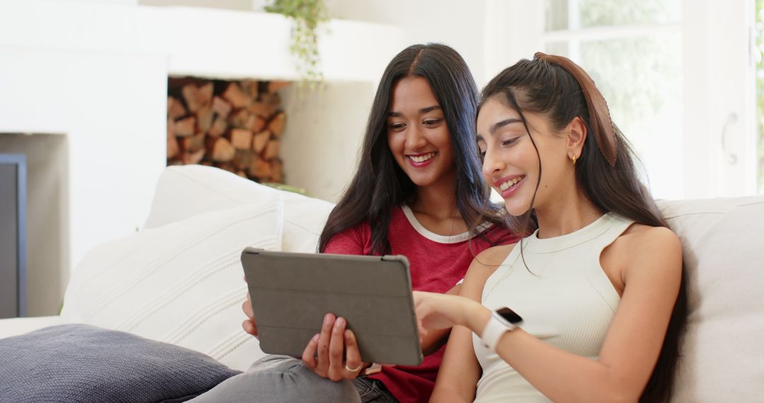 Diverse Friends Enjoying Tablet in Comfortable Living Room